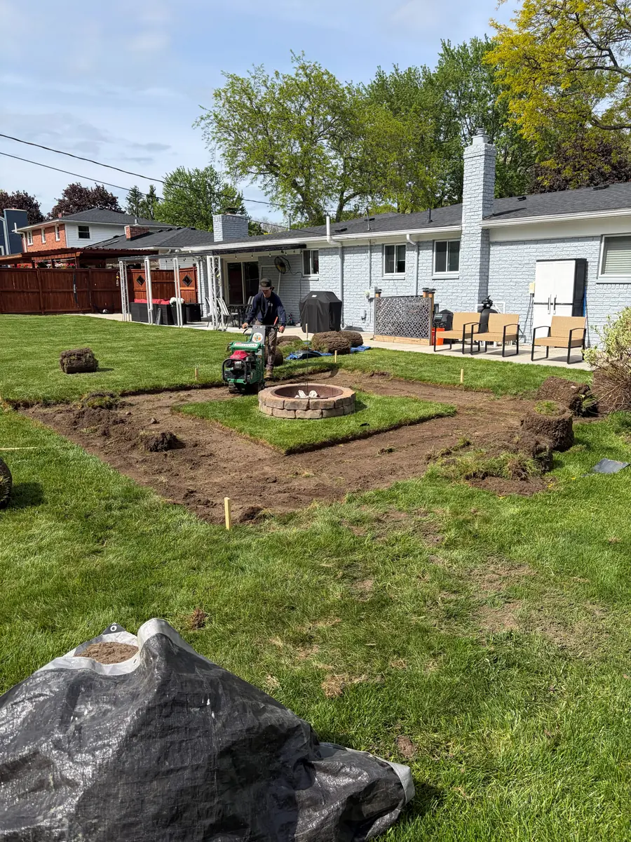 During — Backyard firepit and pea-gravel patio with stepping-stone path